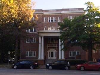 A four-story brick mutli-residential house