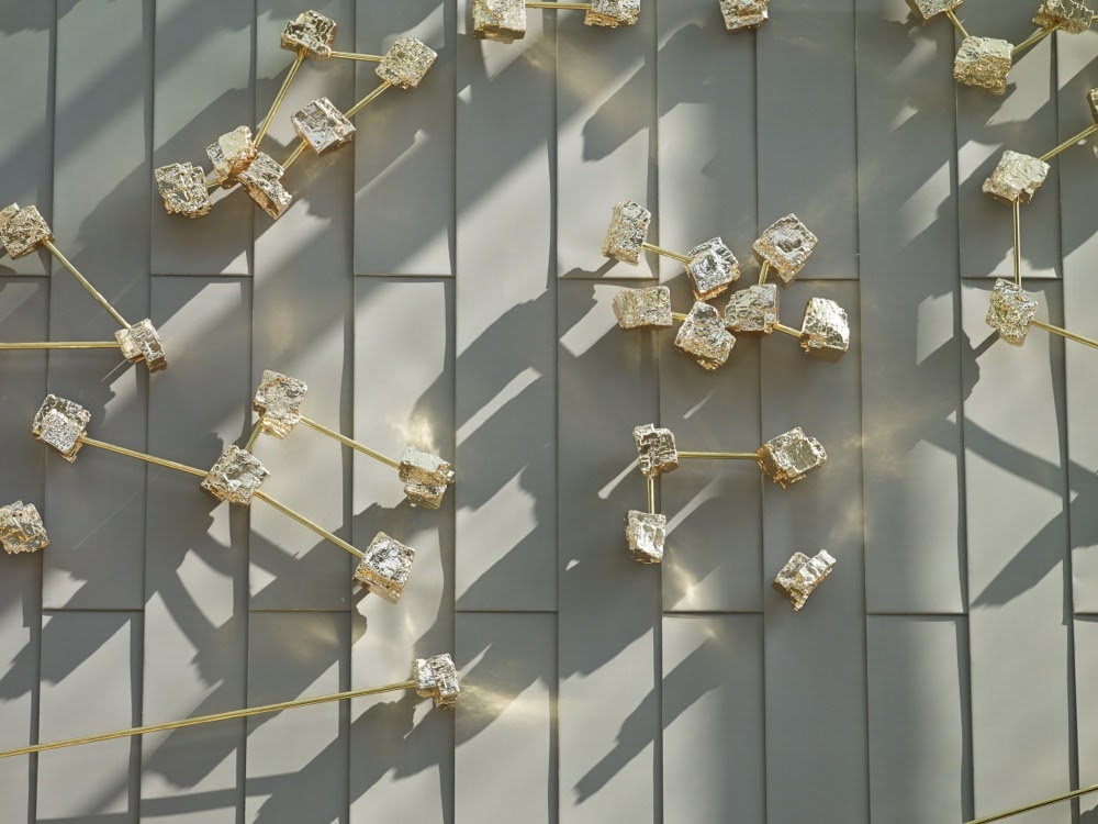 A close-up view of Nocturnal (Navigation), by Teresita Fernández, showing 300 constellation points that resemble crystallized minerals and patterned after a navigational star chart.