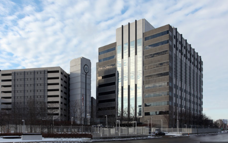 daytime Image of office buildings located at 985 Michigan Avenue against blue sky, Detroit Michigan.