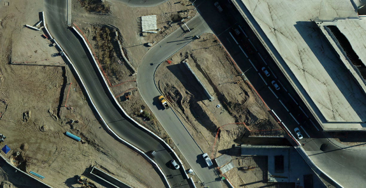 Overhead view of construction area with curved lanes and roads