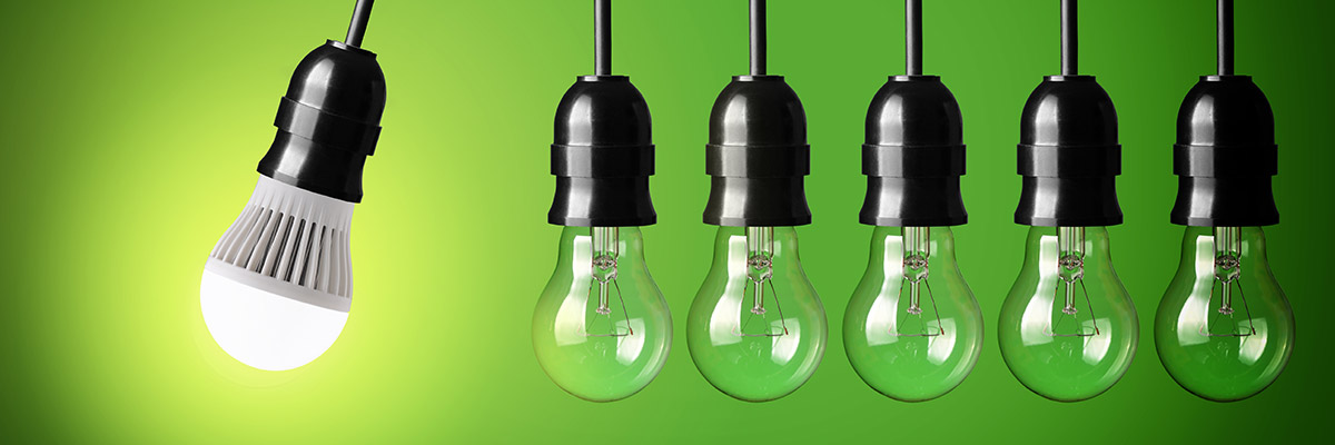 Six light bulbs in a row with the one on the left lit up