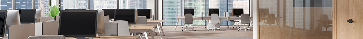 Cropped view of a light-filled office with glass windows and light wood furniture