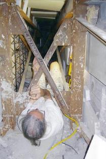 Man in crawlspace