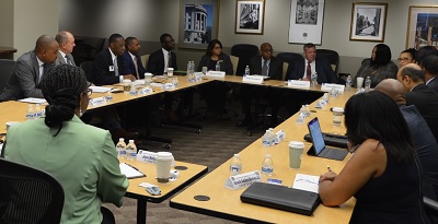 shot of conference room with people at a table