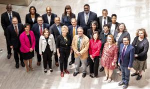 A group of people standing around GSA Administrator Robin Carnahan
