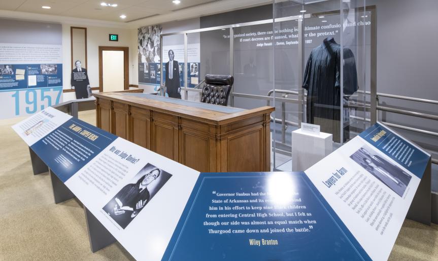 The Cooper bench and a judge's robe on display at the Supreme Court Exhibition.