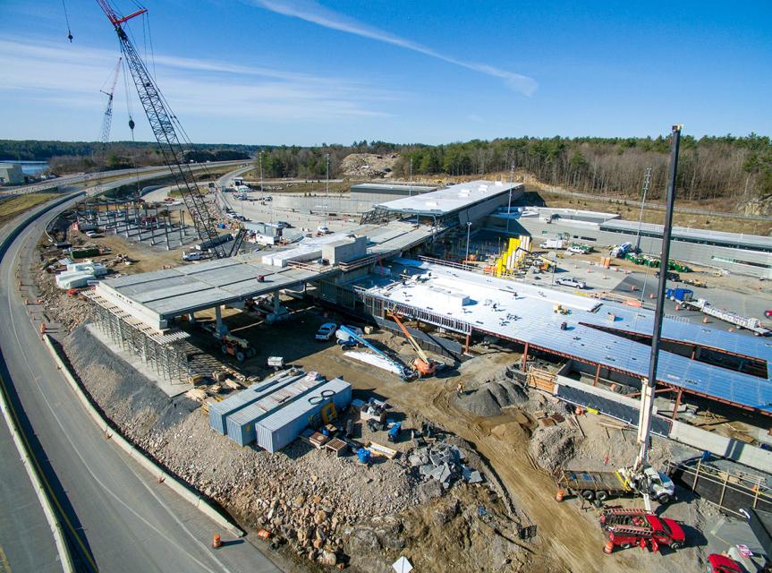 Aerial view of a construction site next to a highway
