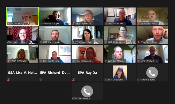 Zoom meeting screenshot with 21 boxes showing participants. 15 participants have cameras on
