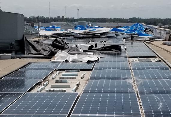 Roof of Cedar Rapids Courthouse with damaged photovoltaic system.
