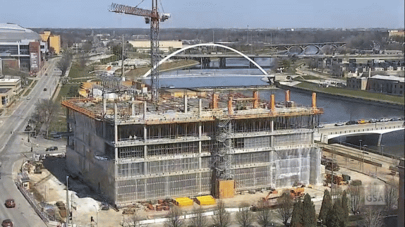 A series of rapid images of a six-story courthouse structure taking shape.