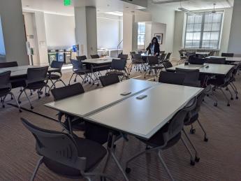 Several white work tables arranged in squares