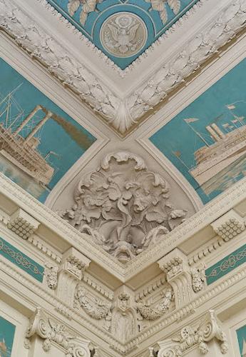 Intricate crown moulding surrounded by maritime-themed murals in the Baltimore Custom House.