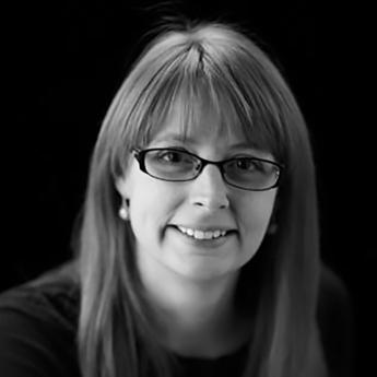 White woman wearing glasses black and white photo