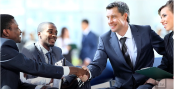 An image of a group of people shaking hands