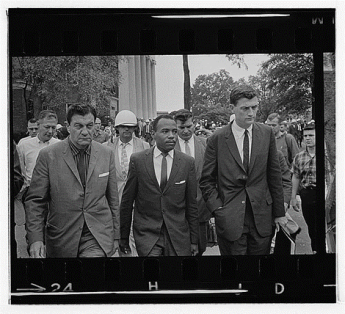 James Meredith being escorted by US marshals to class