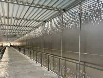 Interior view of a silver pedestrian bridge