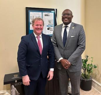 GSA Regional Administrator and Little Rock Mayor Frank Scott, Jr. stand and smile for a photo