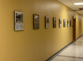 A display made of 8 panels in the main hallway on the 1st floor was created for the U.S. District Courts depicting the history o
