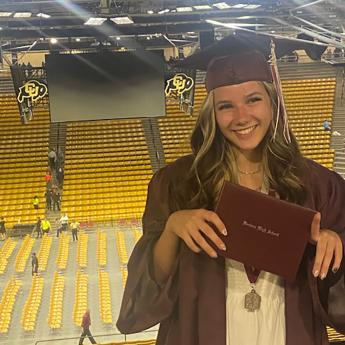 Young woman wearing cap and gown