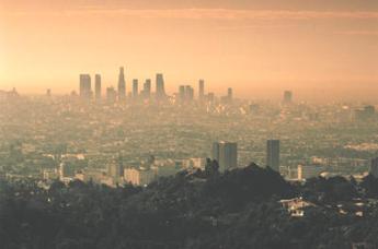 Photo showing a city with a thick layer of orange smog