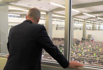 Congressional staffer Chad Tenpenny looks over the submission center where millions of paper tax returns received by mail are op