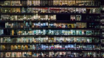Image of windows on a building with varying levels of light