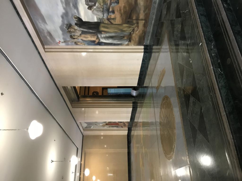 The companion murals are located in the lobby of the Pennsylvania Avenue entrance.