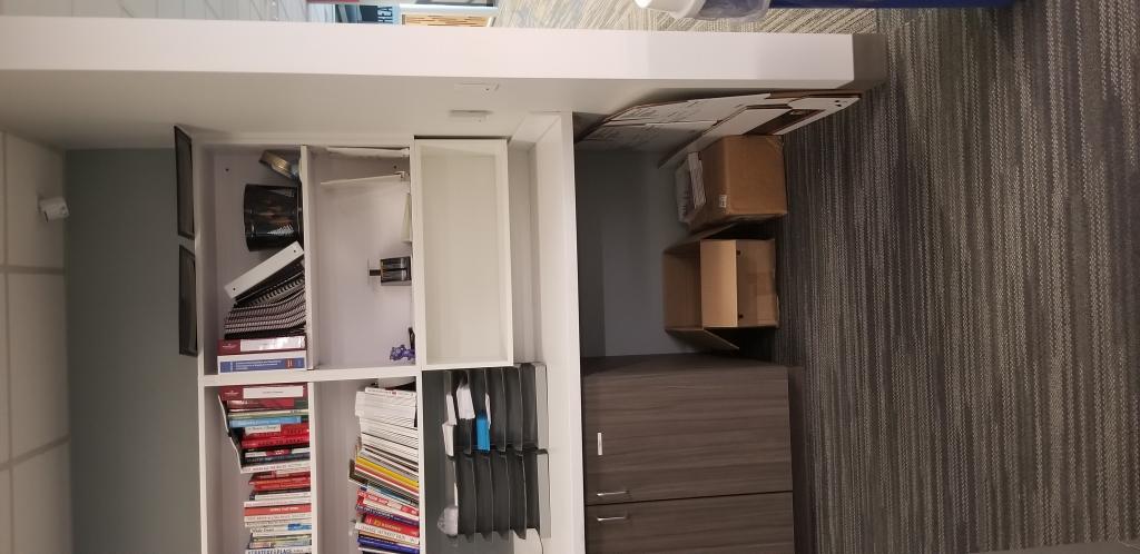 Additional open shelving at an accessible height in supply areas.